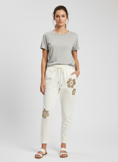white magic pants with gold florals