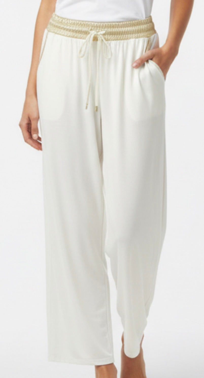 white pants with gold trim