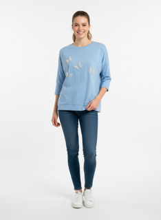 light blue sweater with pearl butterfly details