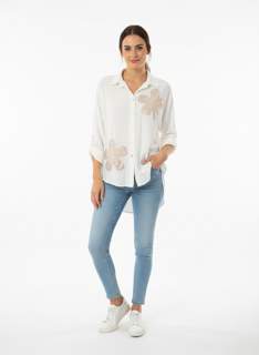 white blouse with flower embellishment
