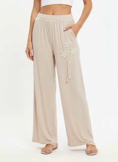 beige wide leg pants with floral lace