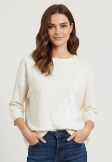 white sweater with sequence design