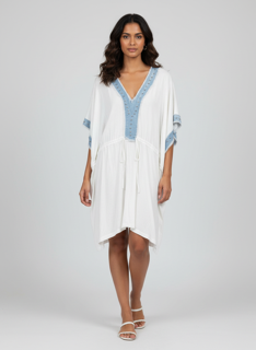 white dress with blue trim and studs