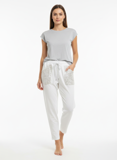 white joggers with gold metallic pockets